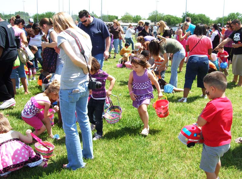 photo of kids and parents hunting for eggs